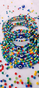 Collier/Bracelet en perles de rocaille multicolores et son œil de protection